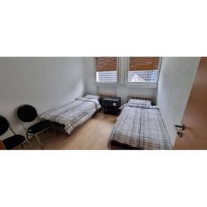 En eller flere senge i et værelse på Monteurhaus in Hemer - Gemeinschaftsnutzung Küche und Bad