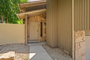 a house with a white door and a fence at Four resorts within 20 minutes from your door step!! in Cottonwood Heights