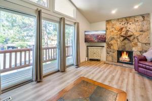 a living room with a stone wall and a fireplace at Four resorts within 20 minutes from your door step!! in Cottonwood Heights
