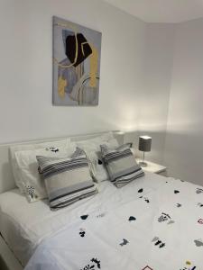 Кровать или кровати в номере Jardines Apartment