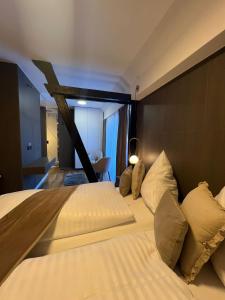 Postel nebo postele na pokoji v ubytování Hotel Harmshof Bispingen