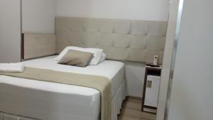 Postel nebo postele na pokoji v ubytování Golden View Hotel