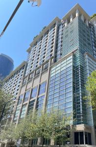 a large office building with a lot of windows at Vancouver Downtown Central 1 bedroom Condo in Vancouver