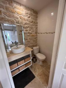 a bathroom with a sink and a toilet at Studio cité gastronomique in Dijon