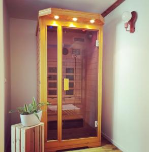 a shower with a glass door in a room at Sentiero Verde B&B in Formazza