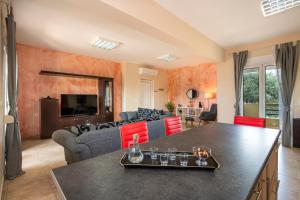 a living room with a couch and a table at Valia's House in Kato Daratso