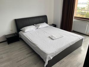 Ένα ή περισσότερα κρεβάτια σε δωμάτιο στο Apartament Summerland Crazy Beach Mamaia