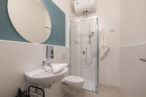a bathroom with a sink toilet and a mirror at Mia Rooms - Room with Private Bath Bolzano Center01 in Bolzano