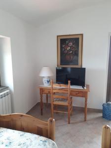 TV a/nebo společenská místnost v ubytování B&B Bene Bennios IUN F1441