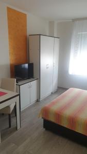 Postel nebo postele na pokoji v ubytování Apartmani Borko 3-1