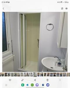 a bathroom with a white sink and a mirror at Vacation Escape - Valley Farm -Clacton-on-sea - Holiday Park in Clacton-on-Sea