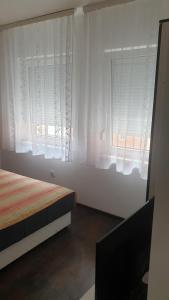 Postel nebo postele na pokoji v ubytování Apartmani Borko 3-3