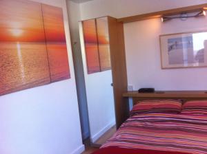 A bed or beds in a room at Culver House Hotel 