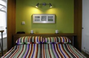 Cama ou camas em um quarto em Culver House Hotel
