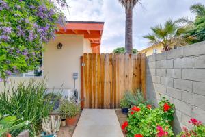 a wooden fence in front of a house with flowers at Sleek San Fernando Studio about 14 Mi to Universal in San Fernando