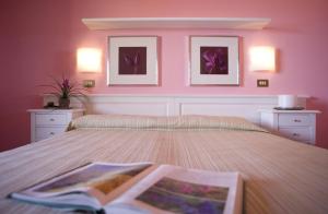 Postel nebo postele na pokoji v ubytování Hotel Barsalini