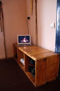 a laptop computer sitting on top of a wooden table at EcoXata in Slavske