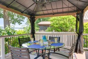 a table and chairs under a gazebo at Commodore Bay Waterfront Home on Lake Norman! in Mooresville