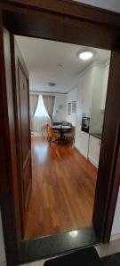 a living room with a table and a dining room at Nota Apartman in Vrnjačka Banja