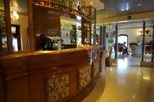 a bar in a restaurant with a counter at Pesaro Palace in Venice