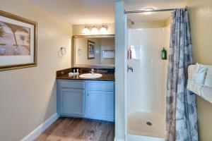 a bathroom with a sink and a shower at Oceanfront Myrtle Beach Condo with Pools and Hot Tubs in Myrtle Beach