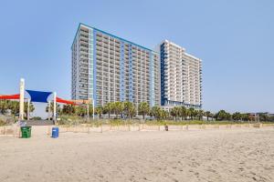 a view of a hotel from the beach at Oceanfront Myrtle Beach Condo with Pools and Hot Tubs in Myrtle Beach