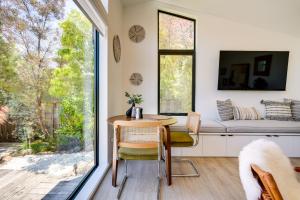 a dining room with a table and a window at Redwood City Escape with Big-Screen TV! in Redwood City