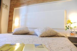 Postel nebo postele na pokoji v ubytování Hotel Barsalini