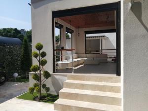 a set of stairs leading up to a house at Casa di Sonia in Eforie Nord