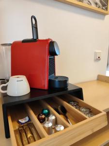 a red toaster sitting on top of a drawer at Haus des Sports in Bad Kreuznach