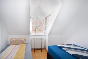 Postel nebo postele na pokoji v ubytování Apartment inmitten der Stadt Leoben. + 3 fotografie