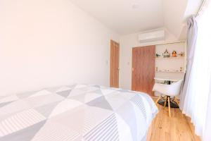 Tempat tidur dalam kamar di 駒込駅徒歩7分/旧古河庭園至近(100m)の4LDKマンション「92m2」