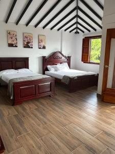 Ένα ή περισσότερα κρεβάτια σε δωμάτιο στο Hotel Campestre Villa Salome