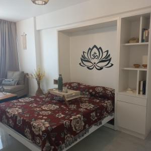 a room with a bed with a table on it at Torres Brickell Departamento -MALVAN- 1A in Tigre +15 photos