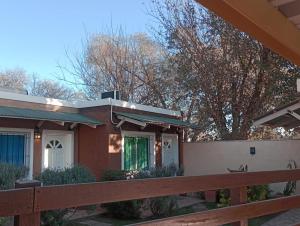 a house with a fence in front of it at APART DEUFELL in Embalse