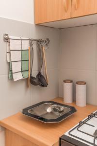 a kitchen with a stove and a counter top at Magnolia apartment in Zagreb