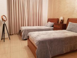 Giường trong phòng chung tại appartement Islane G26 +21 ảnh