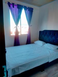 Ένα ή περισσότερα κρεβάτια σε δωμάτιο στο Acogedor Apartamento Arboleda del Campestre