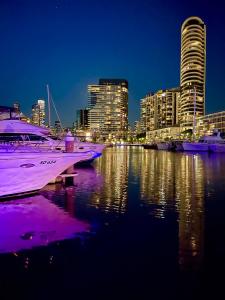 a group of boats docked in a harbor at night at Yarra Accommodation in Melbourne
