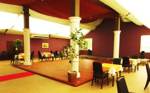 a dining room with tables and chairs in a room at Yufuin Hotel Mori-no-Terrace in Yufuin