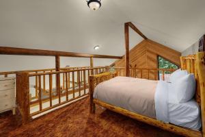 a bedroom with a bed and a balcony at Sky Serenity in Skykomish