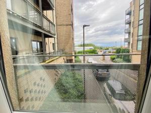 an empty balcony with a view of a street at Lovely double room with private bathroom and Double room with shared toilet & PARKING FREE in Edinburgh