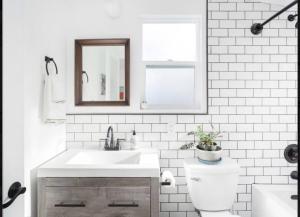 a white bathroom with a sink and a toilet at Venice beach from stunning Casita Indigo studio in Los Angeles