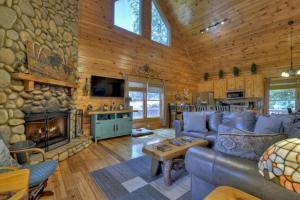 a living room with a couch and a fireplace at Bella Vista in Ellijay