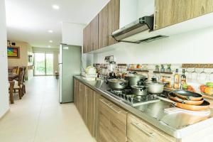 a kitchen with pots and pans on a stove at ¡Apartamento ideal en Sincelejo- Sucre! in Sincelejo