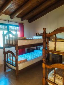 a room with two bunk beds and a window at San Rafael in San Rafael
