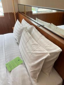 Postel nebo postele na pokoji v ubytování 盤古捷旅 - Panco Hotel