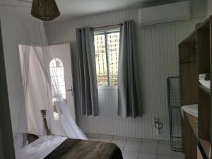 Postel nebo postele na pokoji v ubytování Abri Papaye