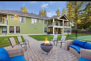 a large house with a fire pit in the yard at Big and Luxury House in Surrey