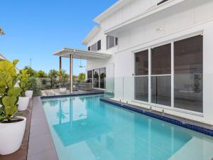 a swimming pool in the backyard of a house at Sunrise Mansion with Pool in Kingscliff